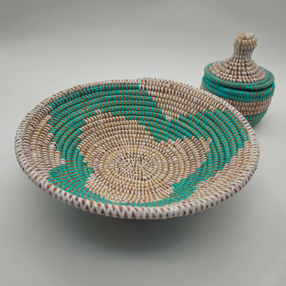 Turquoise Senegalese handwoven shallow basket with coordinating lidded basket
