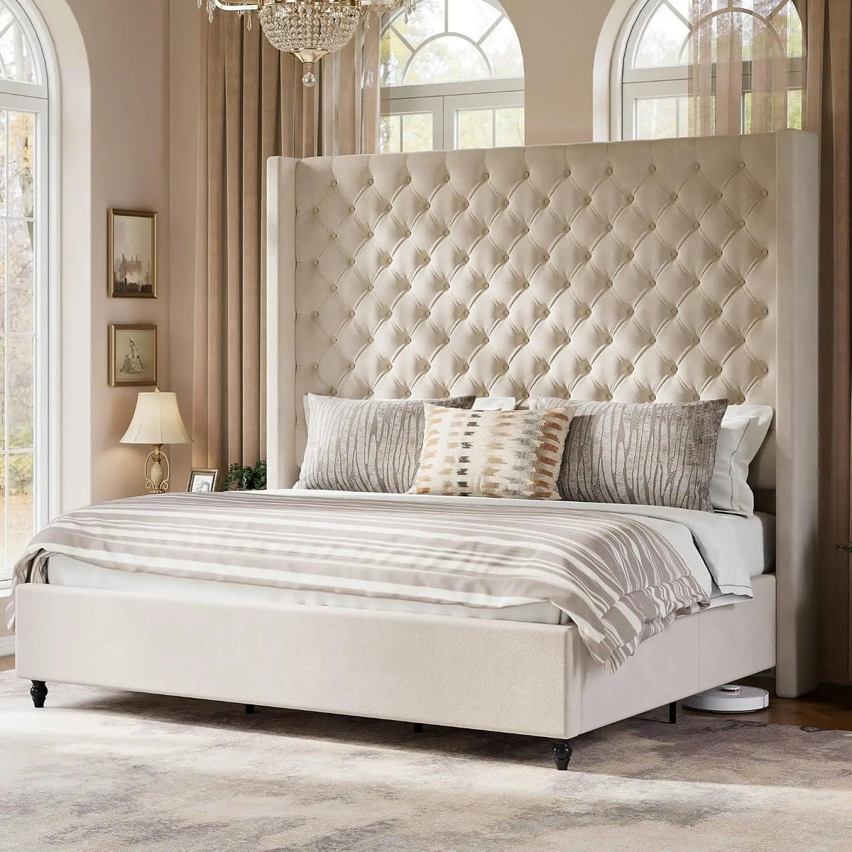Cream tufted wingback bed in an elegant neutral bedroom